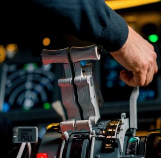 close-up-of-a-pilot-s-hand-pressing-the-throttle-i-2023-12-22-20-29-30-utc