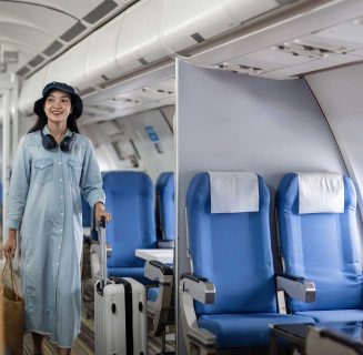 young-woman-tourist-with-a-suitcase-at-the-airplan-2023-12-01-00-35-26-utc